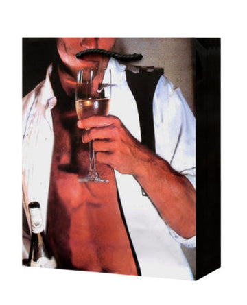 Man in unbuttoned tux drinking champagne gift bag